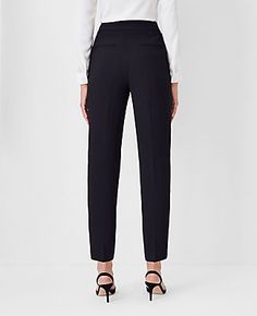 Elevate your wardrobe with the Ann Taylor Petite Side Zip Ankle Pant in Fluid Crepe, designed specifically for a curvy fit. These pants redefine sophistication with their slim leg and ankle-grazing crop, ensuring a flattering silhouette that complements your curves.

- **Size:** Petite - 2
- **Color:** Black
- **Material:** 95% Polyester, 5% Spandex
- **Fit:** Tailored and fitted with a high rise that sits just below the natural waist
- **Length:** Hits at the ankle with a 25" inseam and 13 3/4" Petite Curvy, Lean Legs, Over 60 Fashion, Knitted Suit, 60 Fashion, Leg Design, Slim Leg, Ankle Pants, Waist Length