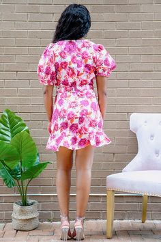 Feel super girly and flirty in our gorgeous Petal Pusher Mini Dress! These bright colors simply scream summer. With this dress, you will be sure to turn heads! This mini dress features v-neckline, a cute puff sleeve with ruffles and ruffled hem. Definitely style this with a lace-up heeled sandal and an adorable mini bag or a structured mini bag. Model is wearing a size small Fits true to size Fabric: 100% Polyester Inseam: 28 inches Pink V-neck Mini Dress With Ruffle Hem, Flirty V-neck Mini Dress For Summer, Flirty Ruffled Puff Sleeve Dress For Garden Party, Flirty Puff Sleeve Dress With Ruffles For Garden Party, Feminine V-neck Dress With Ruffles And Short Sleeves, Ruffled Mini V-neck Dress For Vacation, Cute V-neck Dress With Ruffle Hem, Chic Pink V-neck Ruffle Dress, Spring Mini V-neck Dress With Ruffle Hem