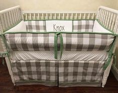 a baby crib with the name krox on it