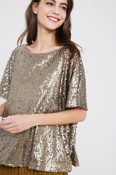 Gorgeous, timeless piece perfect for day or night, dressed up or down. Sequins are NOT just for Christmas, think teamed with distressed denim or leather look for a stylish effortless look you'll love! Available in stunning BRONZE, BLUSH and BLACK. Sequin, boxier style, looser fit, short sleeves and round neck. 100% POLYESTER BRONZE - PRE-ORDER - SHIPS 10/19 Glamorous Evening Tops For Fall, Fitted Tops For Spring Holiday Party, Chic Shimmer Party Tops, Chic Holiday Sequined Tops, Chic Sequined Tops For Holidays, Spring Metallic Sequin Tops, Metallic Sequin Tops For Spring, Chic Metallic Tops For Party Season, Glamorous Holiday Tops