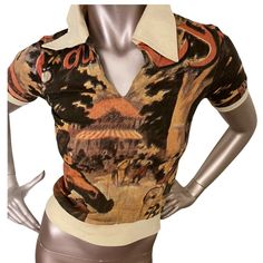 *Chia Bin  Strut cycle All Over Print V-Neck Collar T Shirt short sleeve One of a kind print  Circa 60s/70s. LABEL: Unbranded SIZE: Extra Small Slim Fit  MEASUREMENTS:   • Underarm: 15.5” • Waist: 10” stretches form fitting • measured from collar Sleeve: 7” • Shoulder-14” • Length: 20” COLOR: Multicolor   MATERIAL: 100% Cotton.  CONDITION: Deadstock, no flaws.  Care: Hand wash cold, hang to dry or dry flat. Press as needed with a warm iron.  Please remember that all vintage items are at least 20 Designer V-neck Summer Tops, Designer Printed Tops For Summer, Designer Graphic Print Blouse For Summer, Designer Summer Blouse With Graphic Print, Designer Printed Summer Tops, Designer Blouse With Graphic Print For Summer, Summer Polo Collar Top With Graphic Print, Graphic Print Polo Collar Top For Summer, Summer Graphic Print Top With Polo Collar