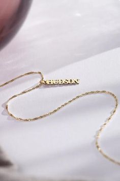 Make a statement with our Vertical Name Necklace, tailored to showcase your unique identity. Perfect for adding a touch of personal charm to any look. #NameNecklace #PersonalizedJewelry #SignatureStyle #thecustomgoodsco #customjewelry #jewelry #handmadejewelry #finejewelry Personalized Nameplate Jewelry With Adjustable Chain, Sterling Silver Birthstone Jewelry For Father's Day, Yellow Gold Jewelry With Adjustable Chain For Mother's Day, Yellow Gold Adjustable Chain Jewelry For Mother's Day, Custom Name Yellow Gold Jewelry For Anniversary, Silver 14k Gold Name Necklace For Anniversary, 14k Gold Nameplate Jewelry For Personalized Gift, Customizable 14k Gold Name Necklace For Anniversary, Elegant Custom Name Jewelry For Anniversary Gift