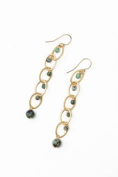 The perfect dangle earrings for the Tranquil Gardens Collection. This artisan design rests at approximately 3" from gold filled ear wires. Matte Gold Plated Brass (nickel and lead-safe) African Turquoise 3", with gold filled ear wires We hand select our natural materials, thus there may be slight variations in color and/or size that will not detract from the overall aesthetic Our unique handcrafted designer jewelry for women is made in America, each design created individually in our personal de Turquoise Dangle Earrings, African Earrings, Natural Stone Earrings, Designer Handmade Jewellery, Turquoise Earrings Dangle, African Turquoise, Artisan Design, Jewelry Diy, Diy Earrings