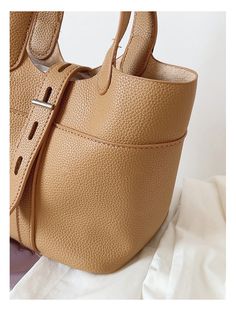 Soft leather bucket bag with matching inner pouch. Material: High Quality PU Leather Crossbody strap included Size approximately 6.9"H x 9.4"W x 5.1"D Designer Style ID: 8734 Bucket Leather Bag with Shoulder Strap and Inner Pouch, Women's Everyday Handbag Daily Use Bucket Shoulder Bag With Gold-tone Hardware, Trendy Bucket Bag With Gold-tone Hardware, Gold-tone Hardware Bucket Shoulder Bag For Daily Use, Trendy Bucket Bag Tote With Gold-tone Hardware, Trendy Bucket Tote Bag With Gold-tone Hardware, Solid Color Crossbody Bucket Bag With Detachable Strap, Daily Use Bucket Satchel With Gold-tone Hardware, Trendy Bucket Bag With Gold-tone Hardware For Daily Use, Trendy Bucket Shoulder Bag With Gold-tone Hardware