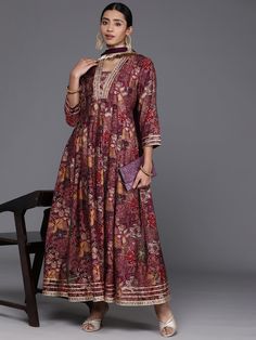 Grab this beautiful 2-piece set. The set comes with floral print & gota patti detailing anarkali kurta has v neck, 3/4th sleeves & calf length teamed with silk chiffon dupatta with lace detailing. Color - Mauve Kurta Fabric-Silk Dupatta Fabric - Silk Chiffon Neck-V Neck Sleeves-3/4th Sleeves Work - Floral Print & Gota Detailing Washing Instructions-Hand Wash DISCLAIMER - The color of the product may be differ due to screen settings of device. A misprint here and a color drop slip there is the beauty of printing which is not treated as a defect. Festive Designer Floral Print Kurta, Multicolor Printed Motifs Anarkali Set For Diwali, Anarkali Palazzo Set With V-neck And Dupatta, Festive Multicolor Anarkali Set With Printed Motifs, Floral Print Long Sleeve Traditional Wear For Festivals, Long Sleeve Floral Print Traditional Wear For Festivals, Festivals Long Sleeve Floral Print Traditional Wear, Designer Anarkali Kurta With Floral Print, Designer Lawn Suit With Floral Print For Navratri