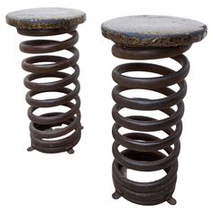 two metal stools sitting next to each other