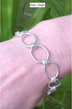 Handmade oblong links are triple linked to add smooth movement. These link chain bracelets fall gracefully around the wrist and hand in sterling silver. Size: Length is 7 1/2" and Width is 1/2" Adjustable Nickel-free Oval Link Sterling Silver Bracelet, Nickel-free Adjustable Sterling Silver Oval Link Bracelet, Sterling Silver Bracelet With Solid Link Construction, Silver Chain Paperclip Bracelet With Oval Links, Nickel Free Sterling Silver Link Bracelet, Nickel-free Sterling Silver Chain Link Bracelet, Nickel-free Sterling Silver Link Bracelet, Adjustable Oval Link Sterling Silver Bracelet, Adjustable Sterling Silver Bracelet With Oval Links