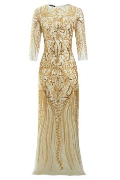 a gold and white dress with an intricate design on the front, long sleeves and back