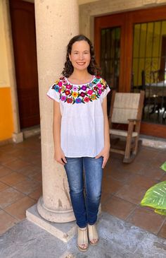 Beautiful and fresh Mexican blouse with beautiful floral embroidery, made entirely by hand by artisans from the state of Oaxaca Mex. The embroidery of each blouse is unique so it may vary the colors. This blouse is one size and fits size S / M Mexican textile art has centuries of history and creativity throughout the country. Mexico is recognized as one of the leading countries with a beautiful aristic production in the textile world, miraculous hands of talented artisans from different states o Embroidered Fiesta Blouse, Embroidered Multicolor Blouse For Fiesta, Multicolor Embroidered Tops For Cinco De Mayo Fiesta, Multicolor Embroidered Top For Fiesta, Multicolor Tops With Embroidered Border For Spring, Spring Multicolor Tops With Embroidered Border, Traditional Blouse With Floral Embroidery For Fiesta, Casual Multicolor Top For Fiesta, Folk Multicolor Embroidered Tops For Cinco De Mayo