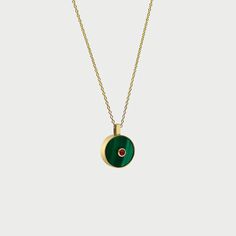 With its rich, vibrant combination of Malachite green and Ruby red, the Necklace N.3 says transformation and abundance in a beautiful way. It is carefully crafted in 14K yellow gold by our master jewelers. 14K yellow gold, Malachite and round Ruby pendant.18" long rolo chain with a loop at 18" and 16".Pendant dimensions: 19.7 mm L, 14.7 mm W, 2.4 mm H.Carat total weight: 0.13 carats. Please note that all pieces are unique. The weight, size and carat weight of each piece can vary slightly from on Luxury Green Malachite Necklace, Luxury Green Pendant Necklace, Luxury Malachite Necklaces For Gifts, Green Medallion Necklace For Formal Occasions, Luxury Green Emerald Gold-plated Necklace, Yellow Gold Green Onyx Gemstone Jewelry, Yellow Gold Malachite Necklaces For Gift, Green Fine Jewelry Necklace With Polished Finish, Oval Malachite Jewelry In Yellow Gold