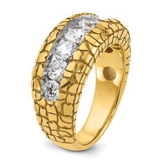 an 18k yellow gold ring with three stones in the center and two rows of diamonds on