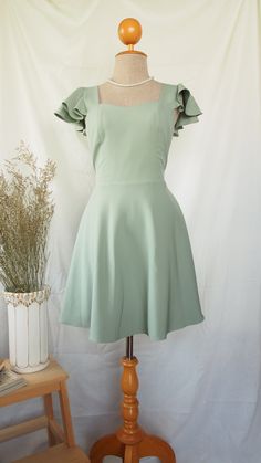 Sage Green Square Neckline Dress, Square Neck Ruffle Dress For Banquets, Square Neck Ruffled Dress For Banquet, Green Sweetheart Neckline Mini Dress For Wedding, Green Mini Dress With Sweetheart Neckline For Wedding, Wedding Mini Dress With Sweetheart Neckline In Green, Summer Fairy Bridesmaid Dress, Green A-line Dress With Fitted Bodice, Green A-line Mini Dress For Wedding