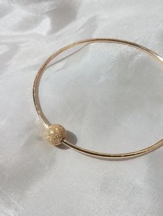 Thick 14G bangles with 1 gold filled accent beads. Available in 16G for $10 less. Also available in silver, just message me. Available in silver for $35. Looks great paired with other bangles. https://www.etsy.com/listing/106162524/custom-14g-bangle-gold-filled Found some special shells on your vacation and want to create a special piece; we can work together to make something you love!! Custom orders welcome, just message me. All jewelry come gift wrapped. Tahitian Pearl Ring, Baby Bangles, The Bangles, Pearl Bangle, Puka Shell, Tahitian Pearls, Bangle Set, Shell Necklaces, Star Charms