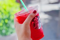 a woman's hand holding a starbucks drink with the words work at starbuckss