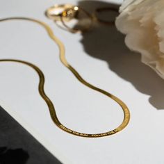 Add a dose of minimalist chic to all your favorite looks with the Majestic Herringbone Chain Necklace that comes in 14K Vermeil and Sterling Silver.The scale-like chain makes it an essential layering piece. If you’re looking to add some herringbone into your wardrobe, this necklace is a solid choice. Adjustable in lengths makes layering even easier. Metal: 14K Gold Vermeil / 925 Sterling Silver Chain Length: 40 cm with extensions from 40 cm to 45 cm (15.57" - 17.72") Dimensions: 2.7 mm / 0.11'' Luna Fashion, Name Chain, Herringbone Chain, Minimalist Chic, 925 Sterling Silver Chain, 14kt Gold, Snake Chain, Layering Pieces, Sterling Silver Chain