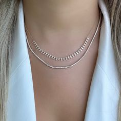 The mini version of our popular 14K gold tribal baguette drop diamond necklace. It offers an eye-catching look that will elevate any outfit. Handcrafted to ensure exceptional quality, this necklace features a unique combination of baguette and round diamonds, set in a tribal design that will add character and sparkle to any look. The luminous baguette diamonds capture the light beautifully, making it an elegant piece that is sure to become a timeless keepsake. Item Information Metal: 14k Gold We Luxury Elegant Jewelry With Baguette Diamonds, Luxury Minimalist Jewelry With Baguette Diamonds, Luxury Evening Jewelry With Baguette Diamonds, Luxury Baguette Diamond Wedding Necklaces, Luxury Classic Baguette Cut Necklace, Luxury Baguette Cut Single Diamond Necklace, Luxury Evening Baguette Diamond Necklaces, Luxury Diamond Baguette Necklace For Wedding, Luxury Delicate Baguette Cut Jewelry