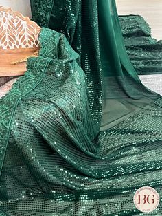 Feel the elegance of Georgette with all over sequin saree in a captivating shade of green. This exquisite saree is ideal for any special occasion and will make you stand out with its sophisticated sparkle. Saree comes with a blouse piece. Fall and pico done. Fully stitched blouse shown in pictures is optional and can be purchased seperately from our blouses and croptops section. For saree video please connect with us on whatsapp @469-937-0606 Ready to be shipped in USA from San Diego, California Traditional Green Sharara For Parties, Festive Green Sharara For Evening, Green Sharara With Zari Work For Party, Party Wear Green Dupatta With Mirror Work, Green Sharara With Dupatta For Evening, Green Sequined Traditional Wear For Eid, Anarkali Green Sharara For Party, Evening Saree For Festivals With Self Design, Festive Green Sharara With Unstitched Blouse