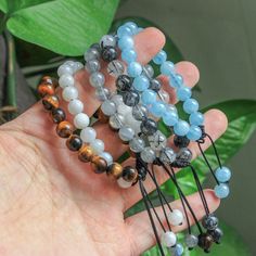 Looking for a unique and beautiful gift?  💖 Check out our crystal bracelets! Each bracelet is made of natural and unique gemstones. Whether you're looking for a special treat for yourself or a loved one, our bracelets are the perfect gift! ⭐ Material: moonstone, labradorite, black rutilated quartz, aquamarine, tiger eye ⭐ Bead size: 8mm ⭐ Bracelet size: approx  6in - 8in (adjustable) ⭐ Quantity: 1pc  🌟 There will be some color and size difference between the real items and the pictures because Spiritual Friendship Bracelets With Gemstone Beads Gift, Beaded Crystal Bracelet For Gifts, Friendship Bracelets With 8mm Round Beads As Gift, Friendship Bracelets With 8mm Round Beads, Round Friendship Bracelets With 8mm Beads As Gift, Gift Bracelets With Round Natural Stones, Spiritual Gemstone Beads Crystal Bracelet Gift, Round Friendship Bracelet With 8mm Beads, Adjustable Beaded Bracelets With Natural Stones For Gift