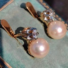 Earrings Size: 16mm height Pearl : 10mm. Diamonds: 0.50ct. Clarity: SI Colour: H Metals Type: 18K Gold Hallmarked Weight: 8.00 grams Condition: Excellent Beautiful, dainty 1930s Art Deco gold diamond and pearl earrings. Contains approximately 0.50 carats of diamonds with Si clarity and H color and stunning South sea cultured pearls high luster  approximately 10 mm in diameter with a golden tone that add femininity to the design. Well-made locks provide comfort and security. The earrings weigh 8 Classic Yellow Gold Diamond Earrings For Evening, Classic Hallmarked Diamond Earrings, Classic Hallmarked Yellow Gold Diamond Earrings, Classic Diamond Drop Earrings With 17 Jewels, Classic Hallmarked Diamond Earrings For Formal Occasions, Classic Hallmarked Diamond Earrings For Formal Events, Timeless Hallmarked Diamond Earrings For Formal Occasions, Classic Round Diamond Earrings For Evening, Vintage Yellow Gold Diamond Earrings With 17 Jewels