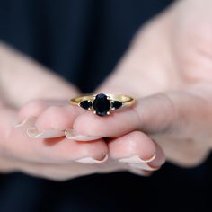 Product Details Mark the special day of your life by gifting your beloved this lovely Three Stone Ring. This Anniversary Ring for Women is adorned with Oval and Pear Cut Black Onyx to make for a luxurious choice for your lady. Crafted with Solid Gold to offer is an opulent appeal. Product Information SKU SHP-RINGS032218641 Width 4.5 mm Height 8 mm Weight 1.92 gm (Approximate) BLACK ONYX INFORMATION No.of Stones 3 Pieces Total Weight 1.46 Carat (Approximate) Dimension(approx) Oval-6X8 mm-1 PcsPea Black Round Sapphire Ring For Anniversary, Black Oval Ring For Wedding, Black Oval Wedding Ring, Black Birthstone Jewelry For Promise Ring, Black Sapphire Ring With Accent Stones For Wedding, Black Jewelry With Center Stone For Anniversary, Black Gemstone Ring For Anniversary, Black Stone Ring Women, Timeless Black Rings For Gift