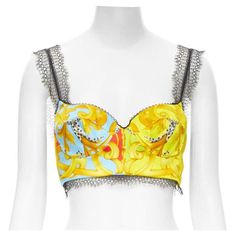 VERSACE Barocco Acanthus Pop lace boned bustier bralette crop top XS IT38 Reference: TGAS/C01011 Brand: Versace Designer: Donatella Versace Model: A78760 A236443 A7000 Collection: Pop Acanthus Barocco Material: Polyester Color: Multicolour Pattern: Floral Closure: Zip Extra Details: Signature Versace boned bustier bralette continuously renewed in new prints every season. Sweetheart neckline with boning and underwire support. Black lace trimmed shoulder strap. Stretch panel at back. Side zip clos Summer Lace Corset, Bra Friendly, Summer Lace Corset With Bra Friendly Design, Summer Lace Corset Bra Friendly, Party Lace Corset Bra Friendly, Lace Party Corset Bra Friendly, Lace Party Corset With Bra Friendly Design, Lace Corset For Party, Bra Friendly, Fitted Crop Top Bra With Removable Pads, Party Lace Crop Top With Spaghetti Straps