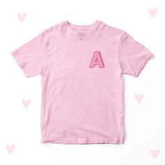 Embroidered Initial T-shirt Children's Embroidered Clothing 100% Cotton. Available in White, Pink, Blue + Black. Available in sizes: 1-2 Years 2-3 Years 3-4 Years 5-6 Years 7-8 Years 9-10 Years  11-12 Years 13-14 Years 40 degree wash. Do not bleach. Do not tumble dry. Do not dry clean. Warm iron. All of our Products are hand pressed and printed. PERSONALISED: If you have ordered a product to be personalised, please ensure that you use our 'Add Notes' feature at the checkout to add Dates, Names o Summer T-shirt With Letter Embroidery And Short Sleeves, Summer Short Sleeve T-shirt With Letter Embroidery, Pink Family Matching Crew Neck T-shirt, Pink Crew Neck T-shirt With Embroidered Graphics, Family Matching Pink Crew Neck T-shirt, Pink Crew Neck T-shirt For Family Matching, Casual School T-shirt With Embroidered Graphics, Casual School Tops With Embroidered Logo, Casual Tops With Embroidered Logo For School