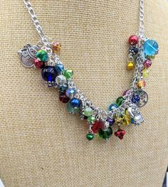 "Old Fashioned Christmas Charm Necklace Search my shop for \"Christmas\" to find matching bracelet and earrings. Chain is 18\" long with a 3\" extension chain.  It has a lobster claw closure. The stainless steel chain links are filled with a rainbow of glass and gem stone beads and crystals - really pretty. Mixed between the beads and gemstones are vintage Christmas themed charms and tiny jingle bells. This makes a great gift or the perfect holiday accessory for yourself! Your necklace will be c Colorful Adjustable Chain Jewelry Gift, Colorful Jewelry With Adjustable Chain For Gifts, Colorful Jewelry With Adjustable Chain As Gift, Colorful Adjustable Chain Jewelry As Gift, Multicolor Jewelry Christmas Gift, Multicolor Christmas Jewelry Gift, Whimsical Multicolor Jewelry With Dangling Charms, Whimsical Multicolor Jewelry With Charms, Whimsical Multicolor Charms Jewelry