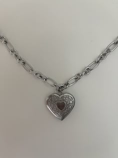 The Chunky Heart Locket Necklace is a sweet and simple staple. It is made with 100% stainless steel. The necklace is tarnish free and sensitive skin safe. The locket is fully functioning and can store two images. The perfect keep safe and the perfect gift. Chunky Locket Necklace, Necklace Locket, Heart Locket Necklace, Silver Lockets, Heart Locket, Locket Necklace, Cute Jewelry, Locket, Necklace Etsy