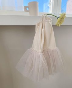 Ribbed sleeveless with tulle skirt Composition - Cotton 100% Care -Machine wash cold with like colors -Tumble dry low Made in Korea Pink Sleeveless Cotton Tutu Dress, Summer Ballet Tutu Dress For Dress-up, Cute Sleeveless Tulle Tutu Dress, Cream Ruffled Tutu Dress For Summer, Cream Ruffled Tutu Dress For Spring, Spring Cream Ruffled Tutu Dress, Spring Party Cotton Tutu Dress, Spring Balletcore Tutu Dress With Tulle Skirt, Sleeveless Tulle Tutu Dress For Summer