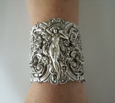 "This beautiful silver plated cuff bracelet has a silver plated art nouveau maiden, silver plated chain and lobster clasp. 2.75\" at the widest part. 7\" long adjustable to 9\" long." Victorian Silver Bracelets For Wedding, Antique Silver Cuff Bracelet With Intricate Design For Wedding, Antique Silver Wedding Cuff Bracelet With Intricate Design, Victorian Silver Wedding Bracelets, Wedding Antique Silver Cuff Bracelet With Intricate Design, Victorian Hallmarked Silver Cuff Bracelet, Victorian Silver Hallmarked Cuff Bracelet, Handmade Victorian Bracelets For Wedding, Antique Silver Cuff Bracelet For Wedding