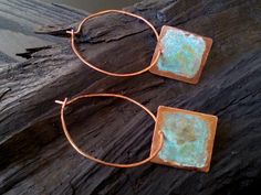 Rustic square charms dance about antiqued copper hoops. I hammered copper wire for strength and gave to the square charm a rustic Patina finish. The hoops can be dangle if i add hooks. You can send me a notice if you want to be with hooks. All my jewelry coated with protective wax finish to prevent tarnish. Available in 3 size: Medium hoops 1.5 inches / 4cm, Large hoops 2 inches / 5cm and X Large hoops 2.5 inches / 6cm *Shades of the patina vary due to the organic chemistry of the patina process Hand Forged Copper Hoop Earrings With Dangle, Hand Forged Copper Dangle Hoop Earrings, Small Bohemian Copper Hoop Earrings, Bohemian Small Hoop Copper Earrings, Bohemian Small Copper Hoop Earrings, Forged Jewelry, Copper Wire Earrings, Cold Connections, Precious Metal Clay Jewelry