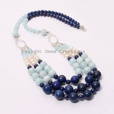 "Product Details : ITEM : AQUAMARINE, LAPIS LAZULI, PEARL BEADED NECKLACE Item Code : DGC2539 Gemstone Name : AQUAMARINE, LAPIS LAZULI, PEARL Chain Style : BEADED Beads Shape : Smooth Round/Rondelle Beads Size : 6mm/7mm/10mm/12 mm Approx Length : 24\"-26\" Inch Approx Weight : 530 Cts. Approx Customization : **Available** Please Feel Free To Contact If You Have Any Query." Blue Lapis Lazuli Beaded Necklaces, Blue Beaded Gems And Cabochons For Gift, Blue Lapis Lazuli Gemstone Beads, Blue Natural Stones For Jewelry Making, Blue Gemstone Beads For Jewelry Making, Blue Gemstone Beads For Gifts, Blue Beaded Necklace With Natural Stones, Blue Faceted Beads Gems And Cabochons For Gift, Blue Polished Beads For Jewelry Making