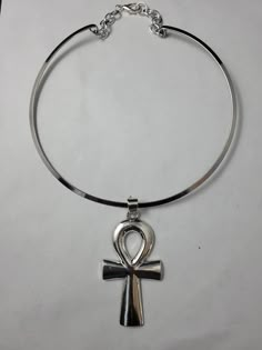 "Beautiful necklace features a 3 1/2\" silver plated ankh on a 15\" silver plated choker.  Please come back and visit to check for new unique designs.  For more styles visit my Etsy shop: www.etsy.com/shop/SoftlySisterDesigns" Cheap Spiritual Ankh Jewelry, Luxury Symbolic Ankh Necklaces, Cheap Ankh Spiritual Jewelry, Cheap Ankh Shaped Metal Jewelry, Cheap Bohemian Ankh Jewelry, Cheap Ankh-shaped Spiritual Jewelry, Cheap Ankh Shaped Spiritual Jewelry, Hip Hop Jewelry Roserys, Luxury Symbolic Ankh Necklace