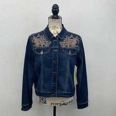 Brand New With Tags Reba/Dillards Denim Blue Jean Jacket Embroidered Beaded Western Spirit Size Adult Medium. Please Make Sure This Jacket Meets Your Size Requirements. Measurements As Follows: Pit To Pit In Front = 20.5” Neckline To Bottom In Front = 17.5” Shoulder To Shoulder In Back = 17” Neckline To Bottom In Back = 20” Waist Across From 18.5” Not The Back Sleeves 28” Condition Is New. This Jacket Was Tried On, Purchased At Dillards, Brought Home, But Never Worn. Retail $148.00 Embroidered Dark Wash Outerwear For Winter, Embroidered Denim Blue Jacket For Fall, Embroidered Dark Wash Denim Jacket For Fall, Embroidered Denim Blue Outerwear For Fall, Embellished Blue Denim Jacket For Spring, Casual Embellished Medium Wash Denim Jacket, Casual Embellished Denim Jacket, Casual Embellished Blue Outerwear, Casual Blue Embellished Outerwear