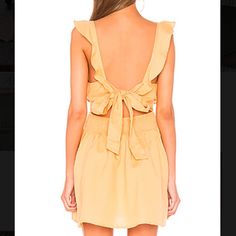 Brand New With Tags. Size Small. Free People Mini Dress With Ruffles And A Tie In The Back. Color Is Called “Sun Yellow” But Is More Of An Orange. Perfect Condition. (Bin 1) Yellow Tie-back Dress For Vacation, Yellow Mini Dress For Casual Wear, Yellow Mini Sundress With Ruffles, Mustard Sundress Mini Dress, Yellow Ruffled Mini Sundress, Yellow Mini Sundress For Beach, Yellow Mini Sundress For The Beach, Casual Yellow Mini Dress With Ruffles, Yellow Mini Sundress For Date Night