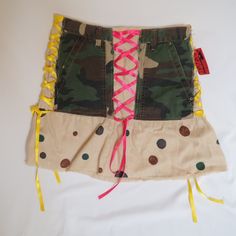 Creatively Redesigned Skirt From 2006, New With Tags. The Base Is A Linen Skirt From Moda International, But "Diva's By Monica" Added Front And Back Pockets From A Pair Of Mudd Camo Pants And Ribbons That Look Like Corset Lacing. The Tag Is Handwritten And Says That It Was Made In 2006. Good Condition, Only Flaws Being A Couple Tiny Brown Dots Near The Bottom, Probably Spills From The Paint Used To Create The Polka Dots. Tag Says Size 8. Waist Is 14.25" And Length Is 17". Y2k Fitted Skirt For Streetwear, Fitted Y2k Skirt For Streetwear, Y2k Mini Cargo Skirt For Spring, Fitted Cargo Skirt For Summer Streetwear, Cotton Fitted Skirt For Streetwear, Fitted Cotton Skirt For Streetwear, Fitted High Waist Cargo Skirt For Streetwear, Green High Waist Y2k Skirt, Y2k High Waist Green Skirt