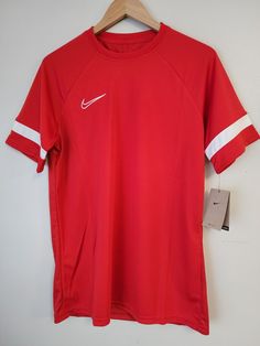 Nike Dri-FIT Academy 21 Size Large Men's Short-Sleeve Soccer Top Red CW6101-658 Nike University Red Tops For Sports Season, Red Sportswear T-shirt For Sports Season, University Red Sportswear Tops For Sports Season, University Red Crew Neck Tops For Sports, Red Crew Neck Sports Top, Red Crew Neck Top For Sports, Red Nike Tops For Sports Season, University Red Moisture-wicking Crew Neck Top, University Red Moisture-wicking Short Sleeve Tops