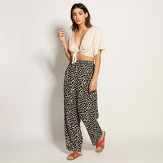 This beautiful cropped wrap top can be styled many ways. Pair with high-waisted skirts, jeans or tailored shorts. 100% Rayon Hand-wash cold Hang Dry Chic High-waist Vacation Tops, Casual Spring Loungewear Crop Top, Trendy Relaxed Fit Crop Top For Vacation, Versatile Summer Crop Top With Short Sleeves, Chic Relaxed Fit Cropped Top, Chic Relaxed Fit Crop Top For Spring, Chic Rayon Pants For Summer, Chic Summer Rayon Pants, Versatile Spring Bottoms