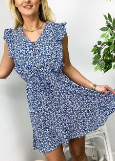 The EMES SHOP dress is detailed with a fun ditsy floral print. Features a v neck line. ruffle front design. sleeveless. button front design. flowy skirt. above knee length. Pair it with a belt and boots for a beautiful look.MATERIAL:95% Polyester 5% SpandexMEASUREMENTS: Product Length 36"-37.5"in 4-6-Small | Waist: 25"-26.5"in | Chest: 33"-34.5"in | Hips: 33.5"-35"in 6-8-Medium | Waist: 26.5"-28"in | Chest: 34.5"-36"in | Hips: 35"-36.5"in 8-10-Large | Waist: 28"-29.5"in | Chest: 36"-37.5"in | Hi V-neck Sundress With Ditsy Floral Print, Ditsy Floral Print V-neck Sundress, Summer V-neck Sundress With Ditsy Floral Print, V-neck Ditsy Floral Print Dress, Casual V-neck Floral Dress With Ruffle Hem, Flowy Ditsy Floral Print V-neck Dress, V-neck Sundress With Ditsy Floral Print For Day Out, V-neck Sundress With Buttons, Front Button Dress