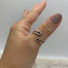 ❤️Silver Safety Pin Ring ❤️ ❤️Introducing our Silver Safety Pin Ring, a unique and stylish accessory that will elevate any outfit! This minimalist piece is perfect for those who want to make a statement with their jewelry without going overboard. The sleek design will make you feel both happy and special every time you wear it. ❤️Made with durable silver plating, this ring is specially designed to fit on the thumb and other fingers, thanks to its adjustable open ring design. You can wear it alone or stack it with other rings for a trendy look. It's a great addition to any jewelry collection and makes for a perfect Mothers Day Gift for Her. ❤️We're committed to providing excellent customer service, so we're offering free shipping and a 15-day return policy for our customers. If for any reas Safety Pin Ring, Open Ring Design, Pin Ring, Thick Ring, Wrap Rings, Open Ring, Safety Pin, Paper Clip, Stylish Accessories