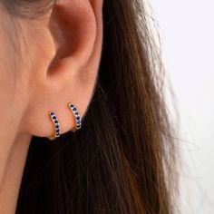 "An all-time bestseller with dark blue sapphire zirconia stones. Elegant and classic, these tiny huggie hoops prong-set with brilliant zirconia gemstones are a beautifully dainty addition to your everyday lineup. Subtle, versatile and perfect to mix and match with other earrings. * D E T A I L S * ∙ Sold individually (1 earring) or as a pair (2 earrings) ∙ Material: .925 Sterling Silver or 18K Gold Plated over .925 Sterling Silver ∙ Stone: Blue Zirconia ∙ Dimensions: Hoop Diameter: 10mm // Width Blue Huggie Hoop Earrings, Hypoallergenic Blue Small Hoop Huggie Earrings, Blue Hypoallergenic Small Hoop Huggie Earrings, Blue Small Hoop Huggie Earrings For Everyday, Blue Minimalist Huggie Hoop Earrings, Minimalist Blue Huggie Hoop Earrings, Blue Minimalist Hoop Huggie Earrings, Blue Huggie Hoop Earrings For Pierced Ears, Blue Huggie Hoop Earrings For Everyday