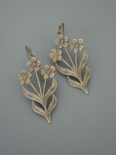 "Vintage Jewelry - Vintage Earrings - Flower Earrings - Flower Jewelry - Brass Earrings - Chloe's Vintage handmade jewelry Such pretty earrings! Vintage brass floral design drops. Would make nice Bridesmaids earrings. Chloe says, \"Wear them and feel fabulous!\" They measure 1 3/4\" long from the top of the ear wire Thanks for visiting Chloe's" Silver Flower-shaped Brass Earrings, Nickel-free Flower-shaped Earrings For Anniversary, Vintage Metal Flower Earrings, Nickel Free Flower Shaped Earrings For Anniversary, Nickel-free Flower Shaped Earrings For Anniversary, Vintage Metal Flower Earrings For Pierced Ears, Vintage Nickel Free Metal Flower Earrings, Vintage Nickel-free Metal Flower Earrings, Pierced Metal Drop Flower Earrings