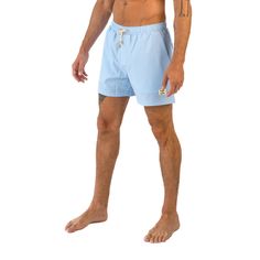 Make a splash this summer with East x East Sea Breeze baby blue men's swim shorts. The serene color and sleek design are perfect for a day at the beach or lounging poolside. Crafted from premium sustainable materials, these shorts are not only stylish but eco-friendly too. The quick-drying fabric and elasticated waistband ensure a comfortable and secure fit, whether you're swimming or playing beach volleyball. With their timeless style and sustainable materials, our Sea Breeze shorts are a must- Blue Swim Trunks With Built-in Shorts For Beach, Casual Blue Swim Trunks With 4-way Stretch, 4-way Stretch Swim Trunks With Built-in Shorts, Blue 4-way Stretch Swim Trunks With Built-in Shorts, Mens Swim Shorts, Beach Volleyball, Sea Breeze, Man Swimming, Sustainable Materials