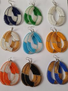 These colorful African Earrings are 100% handmade using fine beads. Perfect addition to your jewelry wardrobe. Listing is for ALL 9pairs. Dimensions; 3 inches long. **Buy multiple items and pay shipping for 1 item only.The will ship free. Thank you for visiting. Traditional Multicolor Hoop Earrings, Traditional Multicolor Round Hoop Earrings, Traditional Beaded Hoop Earrings, Multicolor Festive Jewelry With Ear Wire, Festive Multicolor Jewelry With Ear Wire, Festive Round Beaded Earrings, Beaded Multicolor Chandelier Earrings, Traditional Beaded Dangle Hoop Earrings, Multicolor Beaded Chandelier Earrings