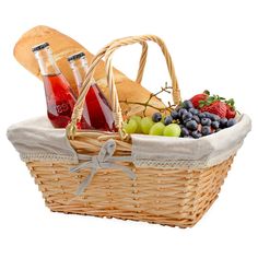 a picnic basket with fruit, bread and sodas in it on a white background