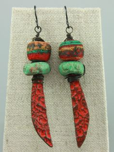 "#1184, Red Pewter Charms from Inviciti's Vincent Cav are paired with Ceramic Discs from Georgia Neumann of At Home In Taos & Lampwork Glass by Jody Brimhall of Inspire Glass. Each earring weighs a light weight of .1 ounce. I can change the earwires, at no cost, from the Black toned ones shown in the photo to another color such as: Purple, Pink, Blue, Bronze (which looks like Antique Copper,) Yellow, or Sterling Silver. See one of the photos for example color choices. Packaging and Shipping to t Hair Sprays, Photo Stickers, Hippie Earrings, Red Boho, Rustic Boho, Colorful Jewelry, Earrings Red, Red Earrings, Allergy Free