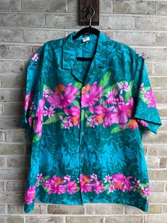 🌺tropical shirt  Buttons down front  🌺label: Royal Creation  Tag size: xxl Care: machine was  Content: polyester  No stretch  Bust:54" Waist:54" Hip:54" Length:32" Shoulder:21.5" 🌺great condition Pink Tropical Top With Camp Collar, Pink Tropical Hawaiian Shirt With Floral Print, Pink Floral Print Tropical Hawaiian Shirt, Tropical Pink Hawaiian Shirt With Floral Print, Green Hawaiian Tops With Hibiscus Print, Pink Hawaiian Shirt With Tropical Print, Green Tropical Hibiscus Print Top, Green Tropical Print Camp Shirt, Green Tropical Print Hawaiian Shirt