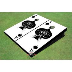 the back side of a white and black cornhole board with an image of two people on it