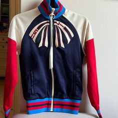 Gucci Bow Track Jacket. Size Xs. Nwt. Red/White/Navy/Royal Blue With Cream Zipper. From The Guccify Yourself Collection Gucci Casual Track Jacket For Winter, Gucci Casual Winter Track Jacket, Casual Gucci Winter Track Jacket, Casual Long Sleeve Gucci Track Jacket, Gucci Long Sleeve Track Jacket For Winter, Gucci Long Sleeve Track Jacket For Fall, Fitted White Gucci Outerwear, Sporty Gucci Outerwear For Fall, Gucci Red Winter Outerwear