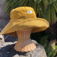 "A yellow wide brim corduroy sun hat for beach days and sunny day fun.  This sun hat for women has a nice wide brim to protect your whole face and even your neck and chest.  Easy to bring along in your bag, folds up easy.   This hat is made from a mustard yellow cotton corduroy fabric.  Inside liner is white cotton.  I used interfacing inside the brim to keep it's shape. Brim measures 4.5\" Crown depth is 3.5\". Contact me for custom fit option. SIZES AVAILABLE S - measures 22.5\" (fits heads wi Cheap Fun Yellow Bucket Hat, Cute Yellow Bucket Hat, Cheap Yellow Festival Hat, Yellow Cotton Hat For Outdoor, Yellow Cotton Outdoor Hat, Yellow Cotton Wide Brim Bucket Hat, Yellow Wide Brim Cotton Bucket Hat, Casual Yellow Bucket Hat, Yellow Bucket Hat With Short Brim For Outdoor